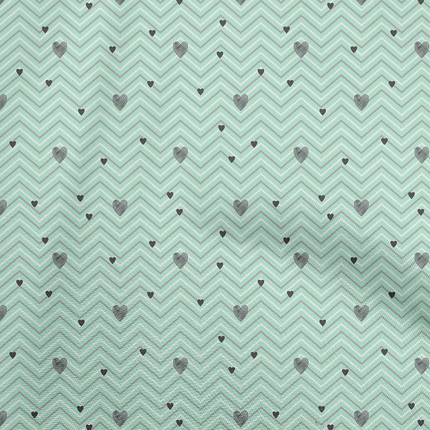 Installing oneOone Velvet Fabric 58 Inch Wide Mint Green Stretch on a wooden cutting table