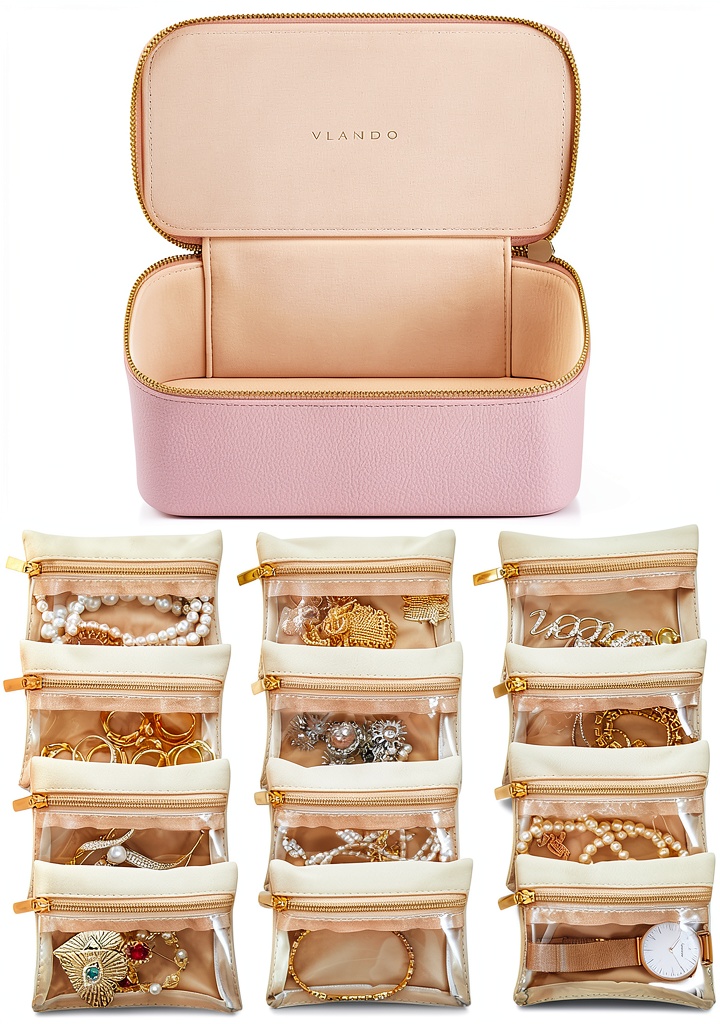 Vlando pink jewelry box on a hotel vanity with open velvet bags displaying earrings, necklaces, and rings